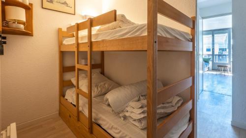 a couple of bunk beds in a room at Grand Morillon - 104 - Montagne Belle Vue Studio 4 in Morillon