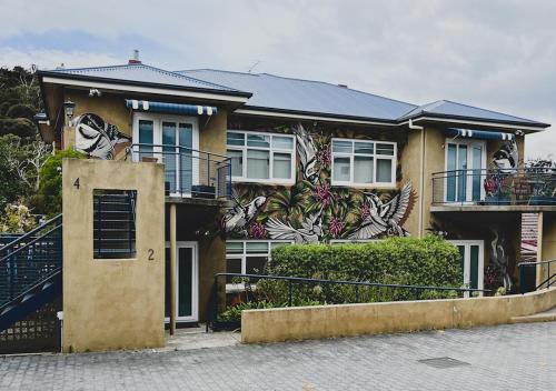a house with a painting on the side of it at Hobart Rose Court Apartments "Avitium" in New Town