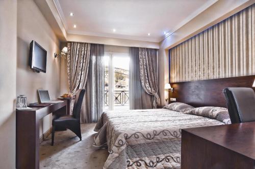 En eller flere senge i et værelse på Phaidon Hotel & Spa