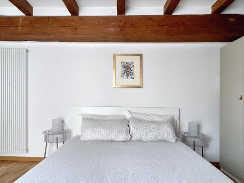 A bed or beds in a room at UR NEST Santo Stefano