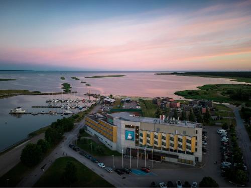 an aerial view of a building next to a body of water at Georg Ots Spa Hotel in Kuressaare