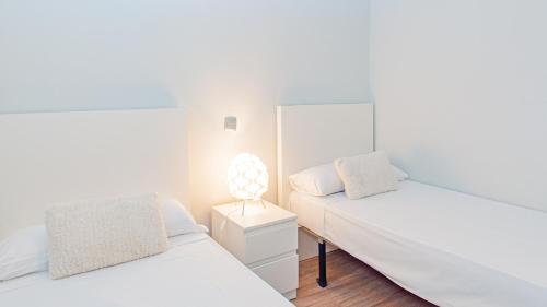Postel nebo postele na pokoji v ubytování MyFlats Azul