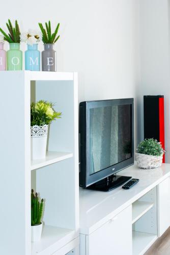 TV a/nebo společenská místnost v ubytování MyFlats Azul