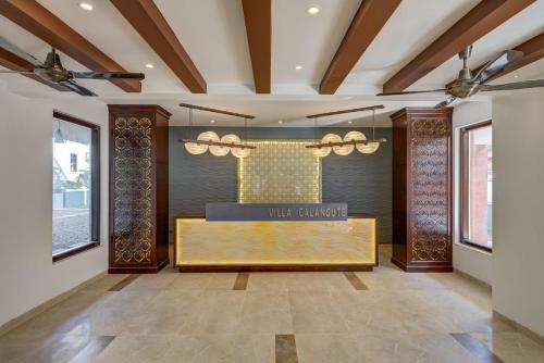 a lobby with a will boulder sign on the wall at Luxurious Villa with Private Swimming Pool, Kids Pool, Games, Private Parking in Calangute