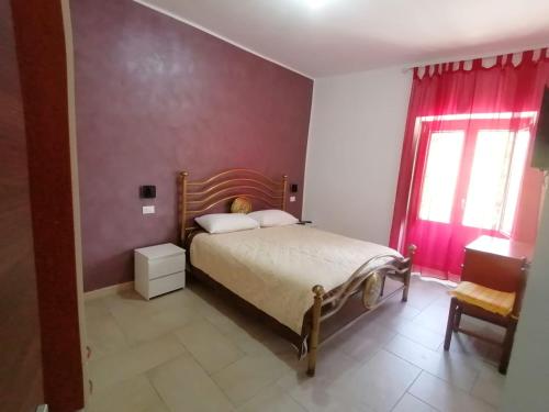 A bed or beds in a room at Al Belvedere
