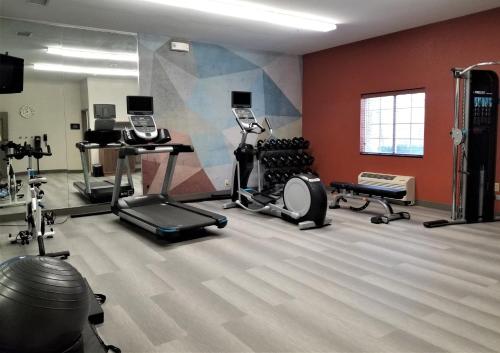 a gym with exercise equipment in a room at Candlewood Suites Apex Raleigh Area by IHG in Apex