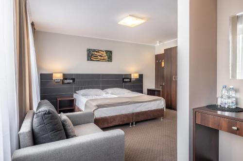 Postel nebo postele na pokoji v ubytování Hotel Leśny