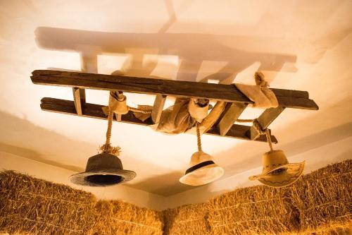 a group of bells hanging from a ceiling at Re dream suite a tema - Rapallo in Rapallo