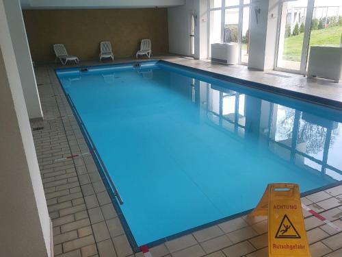 a large swimming pool in a building at Ferienwohnungen Schönwald in Schönwald
