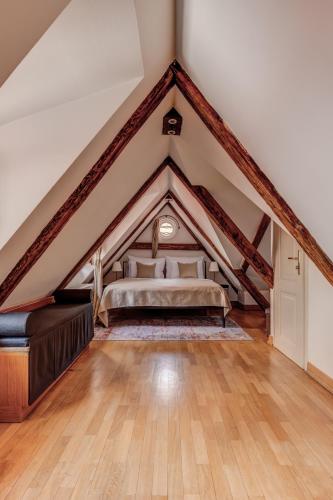 a bedroom with a bed in a attic at Hotel Nerudova 211 in Prague
