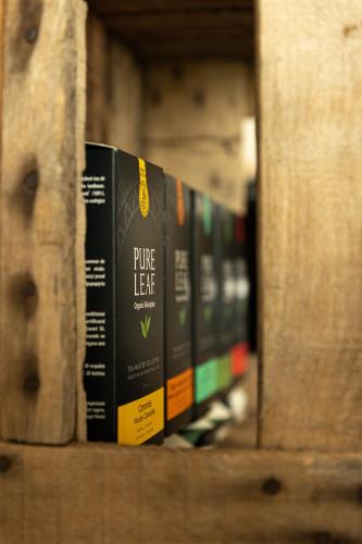 a row of books sitting on a shelf at Rozeboom Loft in Aartrijke