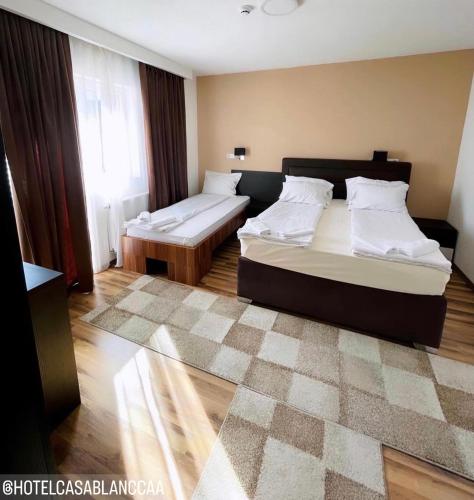 Postel nebo postele na pokoji v ubytování Hotel Casablanca