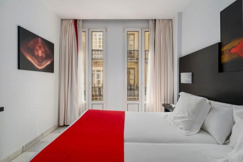 Postel nebo postele na pokoji v ubytování Hotel Del Pintor