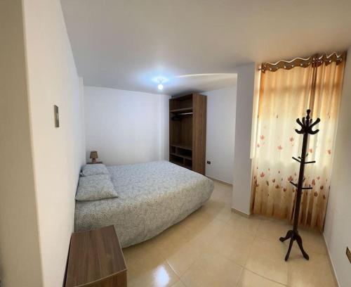 En eller flere senge i et værelse på Apartamento Exclusivo Monty´s