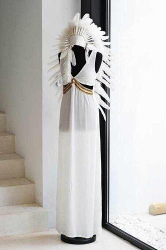 a white dress in front of a mirror at Balinese Villa near the beach outdoor jacuzzi in Cala Llonga