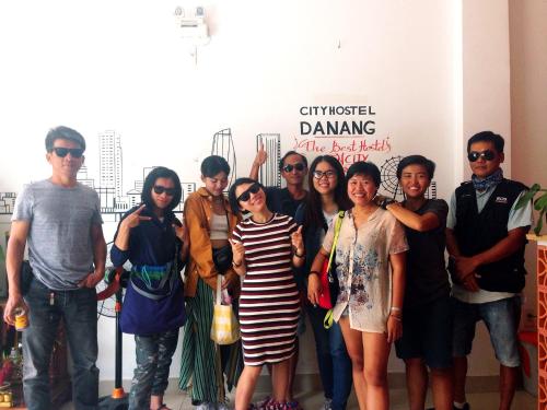 a group of people posing for a picture at an event at City Hostel Da Nang in Da Nang