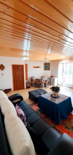 a living room with a couch and a table at casa rural La Plazuela de Mari in Pereña