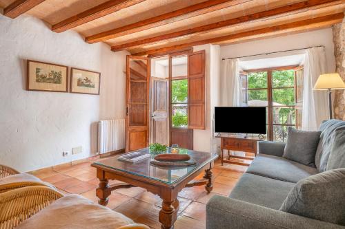 a living room with a couch and a coffee table at Agroturismo Son Siurana in Alcudia