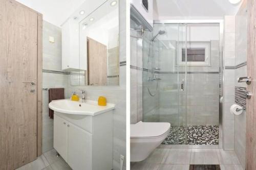 特羅吉爾的住宿－Tudija apartments，浴室配有卫生间水槽和淋浴。