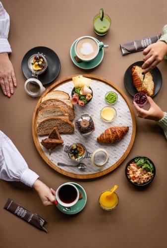 a table with a plate of breakfast food on it at In het Assendorpje in Zwolle