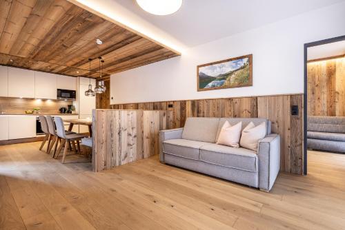 a living room with a couch and a table at Ferienanlage Central in Flachau