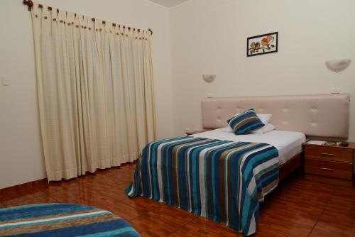 Postel nebo postele na pokoji v ubytování Casablanca Hotel