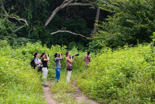 a group of people walking down a dirt trail at La Mello Country House in Palomino