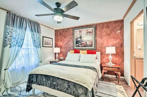 a bedroom with a bed and a ceiling fan at Charming Blue Knob Home Near Golfing and Skiing 