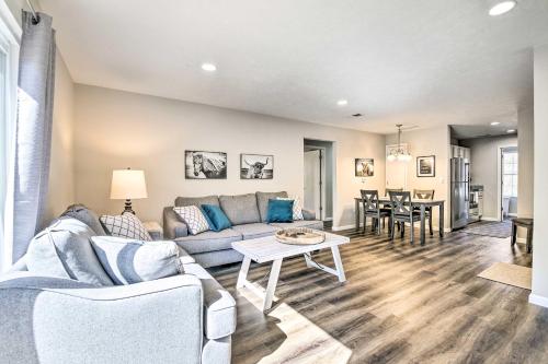 a living room with a couch and a table at Branson Condo with Balcony Near Silver Dollar City in Branson