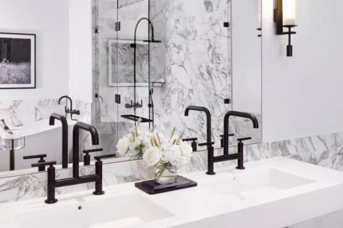a bathroom with a sink with four faucets at The Estate Yountville in Yountville