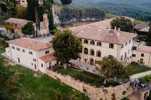 an aerial view of a large white building with a tree at Wine Resort Dievole in Vagliagli