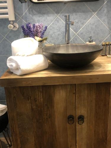a sink on top of a wooden counter with towels at Ca' di Giò in Venice