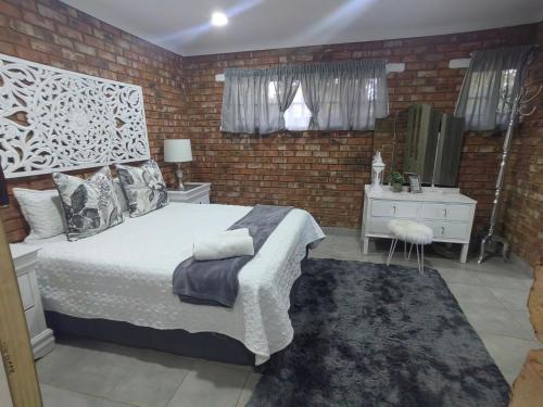 Katil atau katil-katil dalam bilik di Zhantique Airport Guest House Unit 3