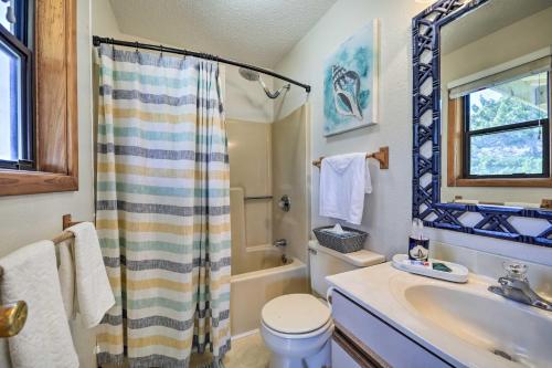 a bathroom with a shower and a toilet and a sink at Walk to Bay and Boat Launch Beach House in Avon in Avon