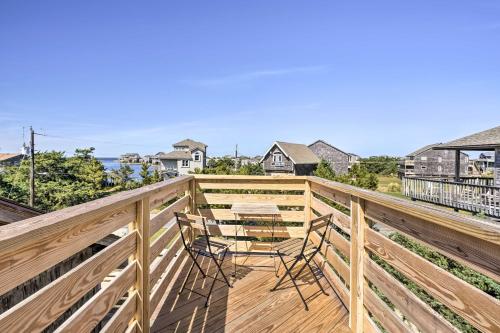 a deck with two chairs and a table on it at Walk to Bay and Boat Launch Beach House in Avon in Avon