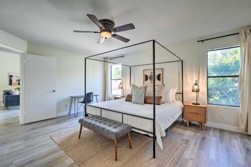 a bedroom with a canopy bed and a ceiling fan at Private Pool, Gas Grill Chic Glendale Home! in Glendale