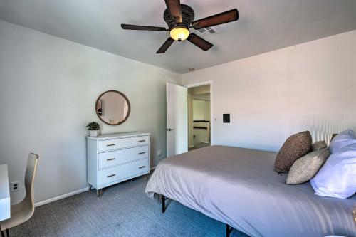 a bedroom with a bed and a ceiling fan at Private Pool, Gas Grill Chic Glendale Home! in Glendale