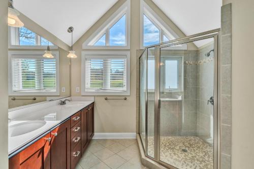 a bathroom with a shower and a sink at Osprey Cove in Moneta