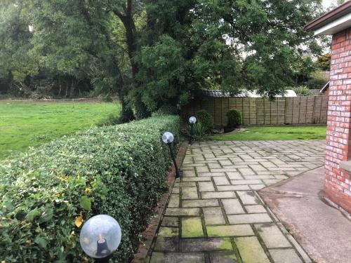 a garden with two street lights in a yard at Stunning 5-Bed House in Clones in Cluain Eois