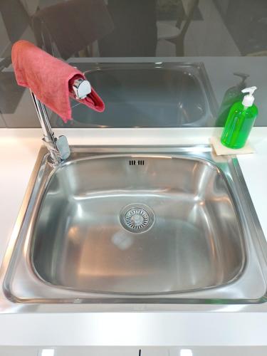 a kitchen sink with a santa hat on it at Almas Suites 银河空间 Netflix BySTAY in Nusajaya