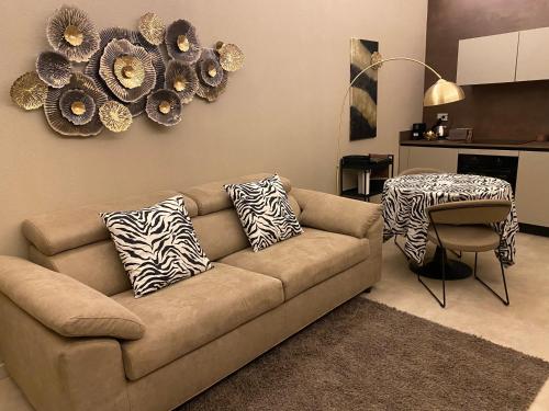 a living room with a couch and a table at Parma Centro House in Parma