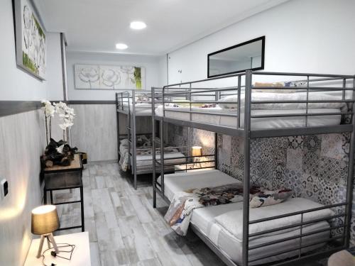 Postel nebo postele na pokoji v ubytování Albergue Piedad