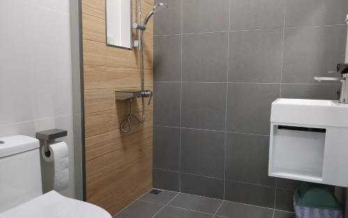 a bathroom with a shower with a toilet and a sink at Private Pool Villa with Jacuzzi at Royal Park Village - Walk to the Beach - 6 people - max 3 males in Jomtien Beach