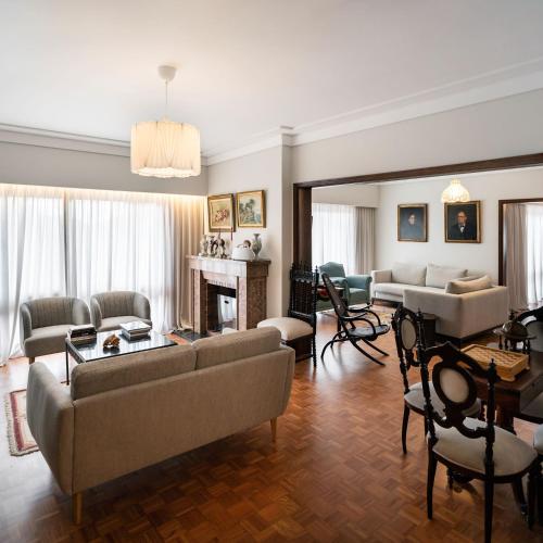 a living room with couches and a fireplace at Santiago Family House - Luxury Guest House in Sever do Vouga