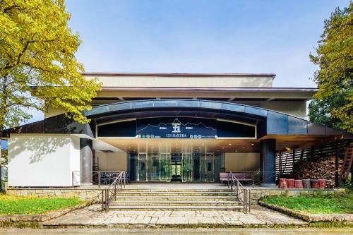 a building with stairs in front of it at 151 Hakuba by Jade Group in Hakuba