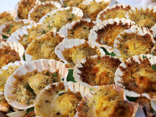 a bunch of muffins in paper cups on a table at Hotel Villa Rosa in Nago-Torbole