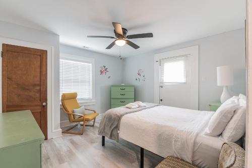 a bedroom with a bed and a ceiling fan at Large Patio with Ocean Views Beach Block Parking Unit 3 in Ventnor City