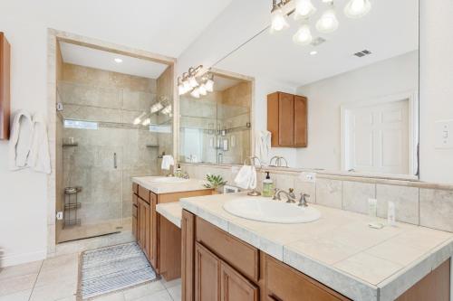 a bathroom with a sink and a shower at Cliff side Oasis in Spicewood