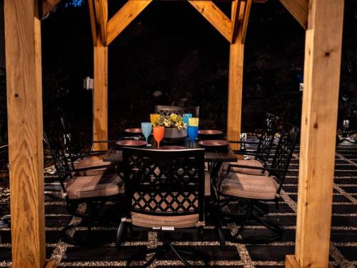 a table with chairs and drinks on a patio at Pool! Quite, Private, remodeled home on the hill in Placerville