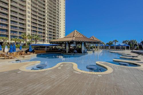 a large swimming pool with a gazebo and buildings at Madiera Magic in Myrtle Beach